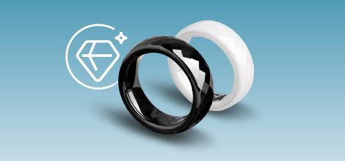 Divi gredzeni: balts un melns ar spīdīgu virsmu. Uz gredzena iekšpuses redzams VISA logotips.