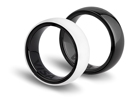Two rings: one white with a black interior and one black with a shiny surface. The VISA logo is visible inside the white ring.
